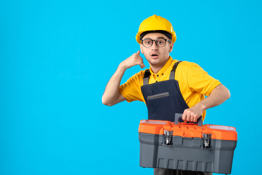 front-view-hurrying-male-worker-yellow-uniform-with-tool-box-blue